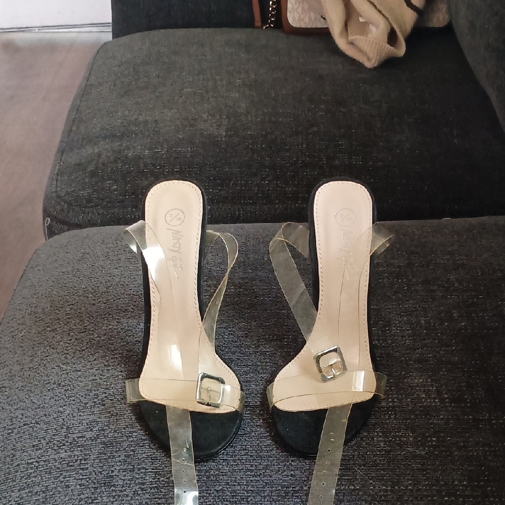 Nasty Gal clear stiletto sandals featuring a transparent strap and a high heel. 